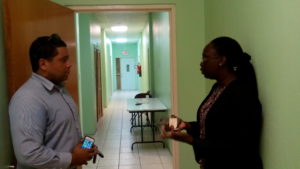 Andrew Skerrit, PS in the Office of the Prime Minister discusses recommendations for NEOC activation with Dep. NDC, Claricia Langley-Stevens